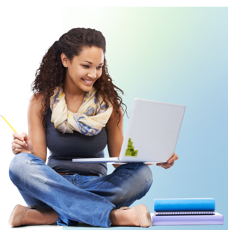 Young woman with a computer sitting down doing school work.